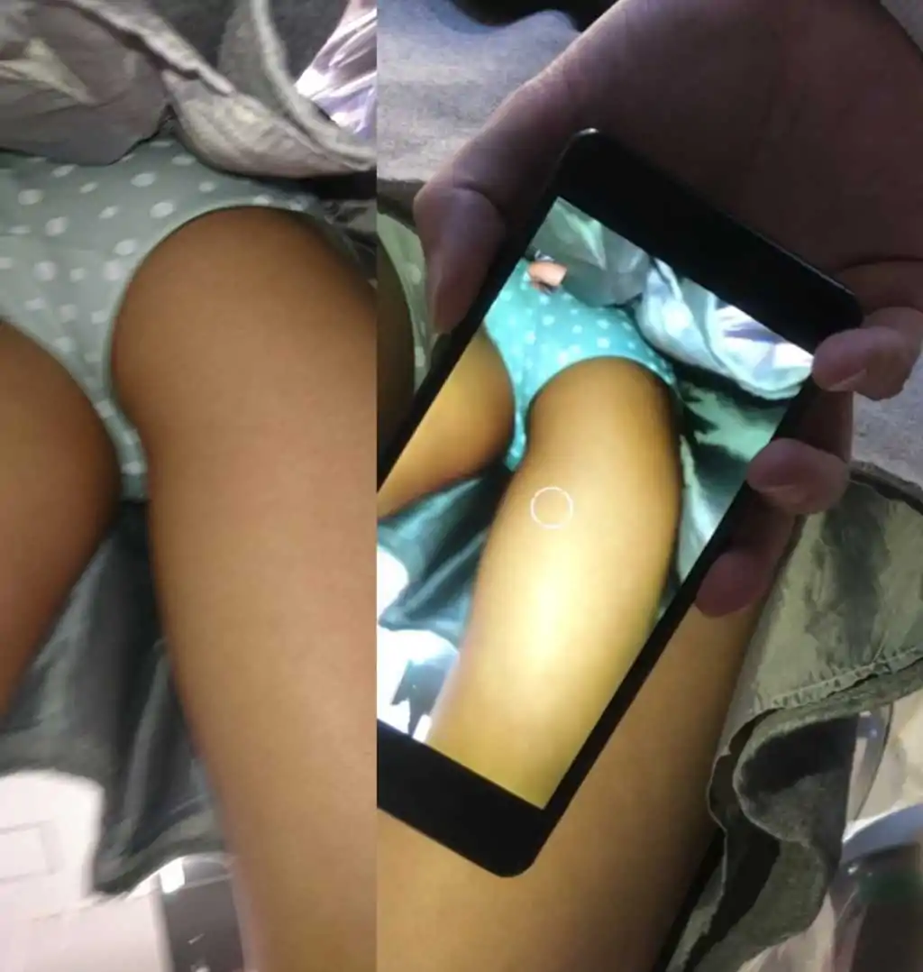 Upskirting two asian teenies with phone